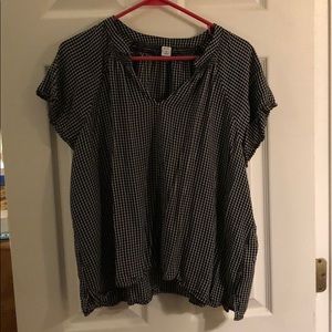 Checkered short sleeved shirt.